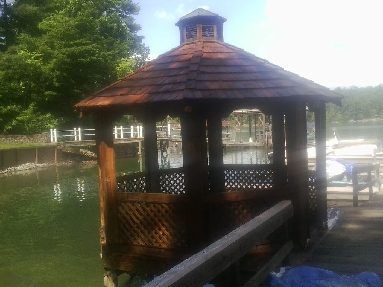 Cedar shake gazebo roof rebuilt on a lake dock in Kents Store